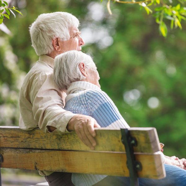 an elderly couple sitting together