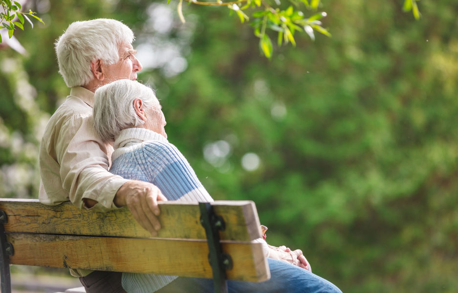 an elderly couple sitting together