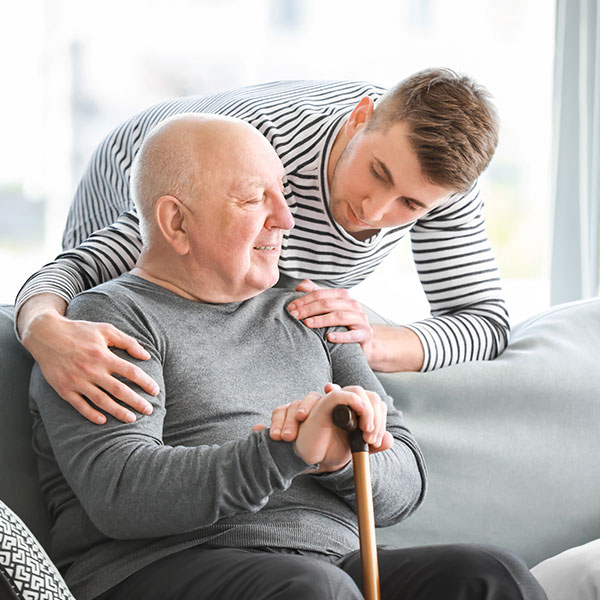 special needs care assistant with man