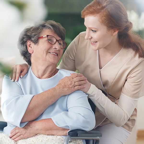 a young woman comforting an older woman