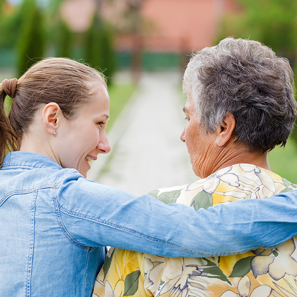 young woman comforting an older woman