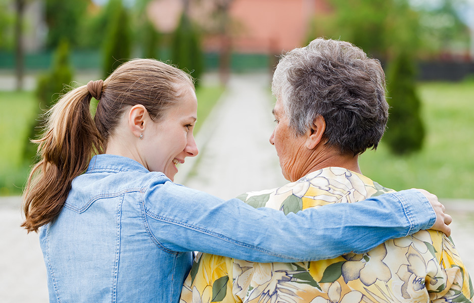 young woman comforting an older woman